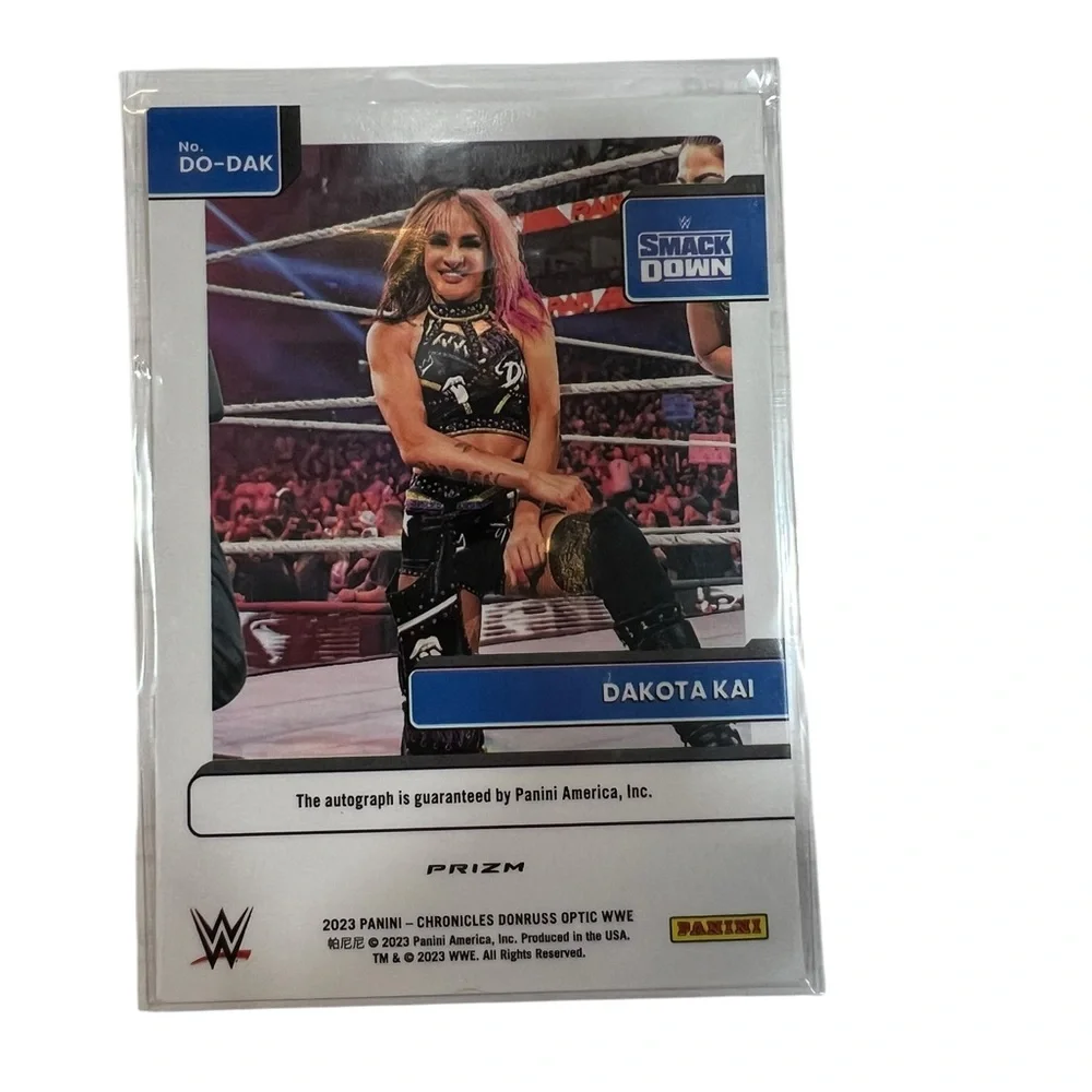 2023 Panini Chronicles WWE Dakota Kai Optic Signature Series Red Auto #DO-DAK SP